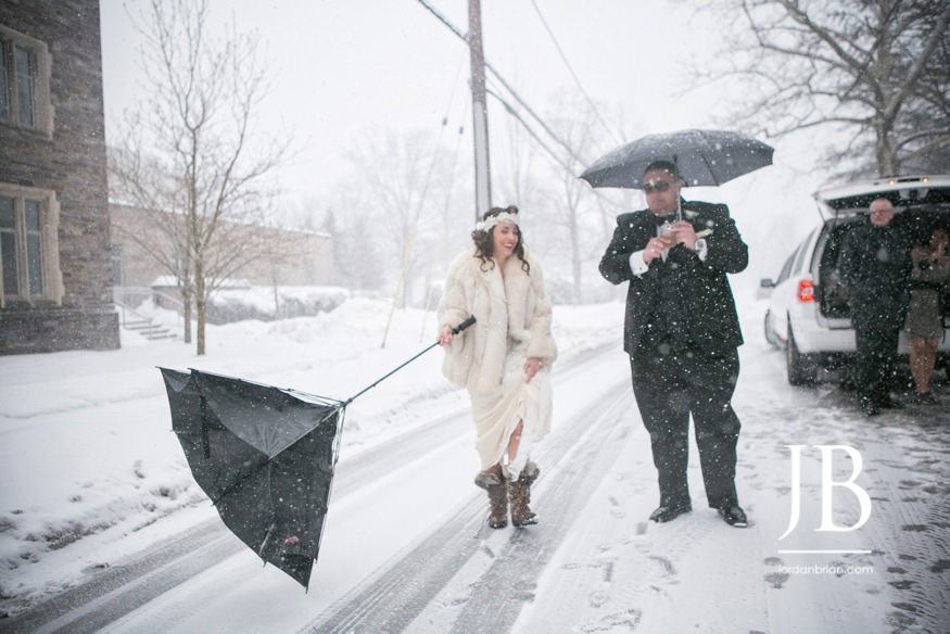 Snow falling on Francesca and Michael during their Princeton portraits