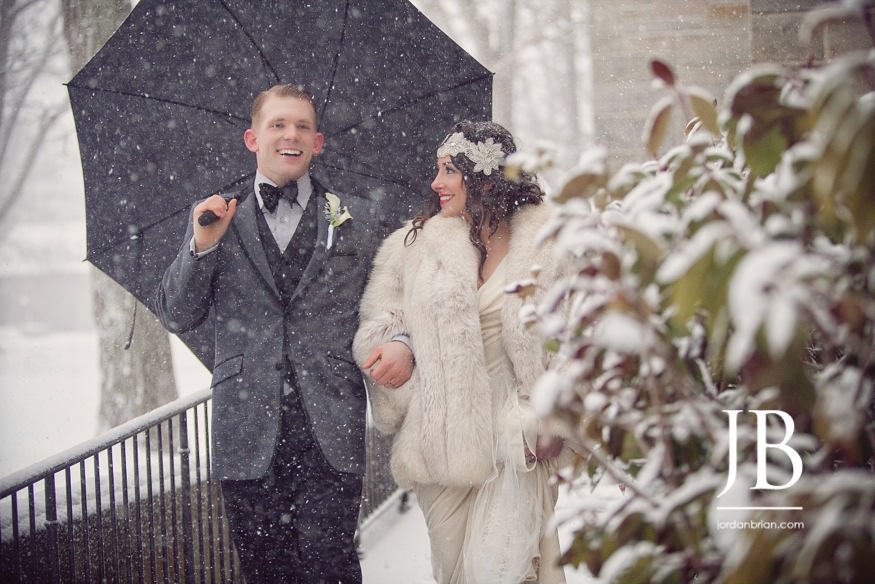 Francesca and Michael under the falling snow at Princeton University