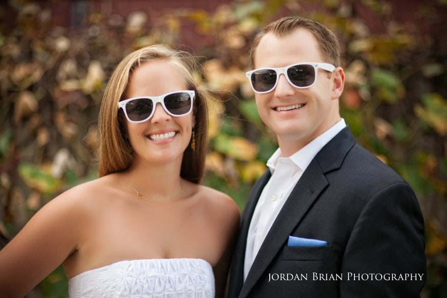 Engagement portrait among fall vines at Valenzano Winery