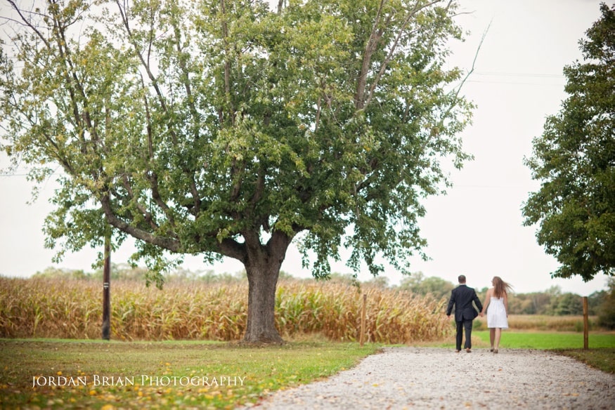 Gina and Ryan share a kiss at Valenzano Winery