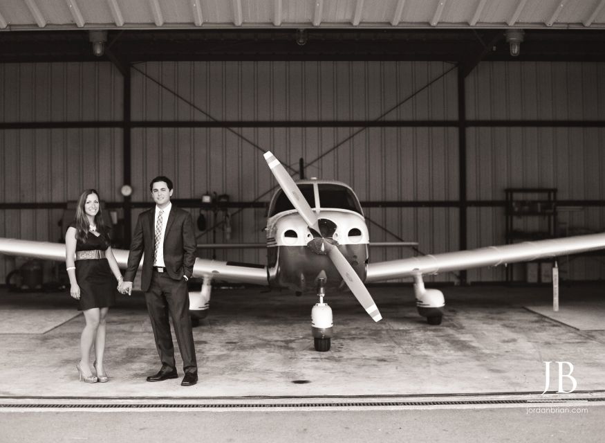 Gina smiling at Steve during film engagement session at South Jersey private airport