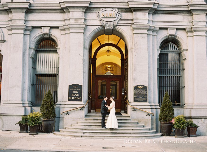 Grace and Max portraits along Market Street Philadelphia after their courthouse elopement