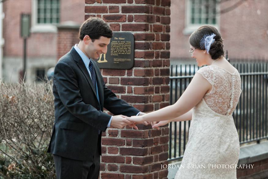 Grace and Max with family at Philadelphia Federal Courthouse after their winter elopement ceremony
