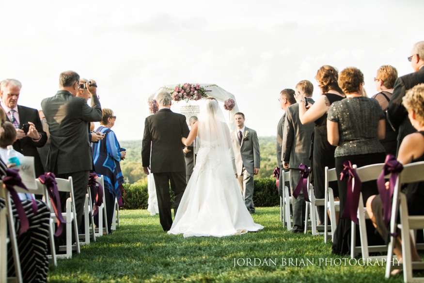 Father and bride walk down the aisle at Trump National Golf Course wedding.