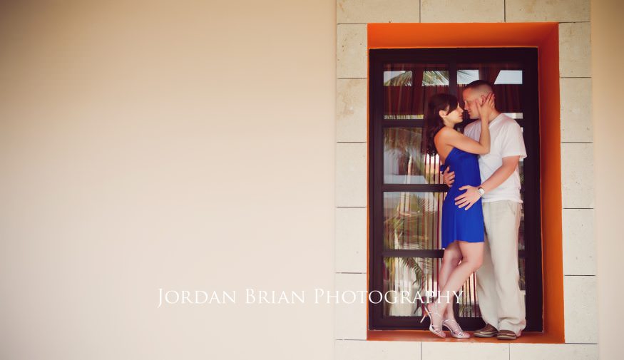 Jillian and Ryan poolside engagement photograph Excellence Resort Mexico