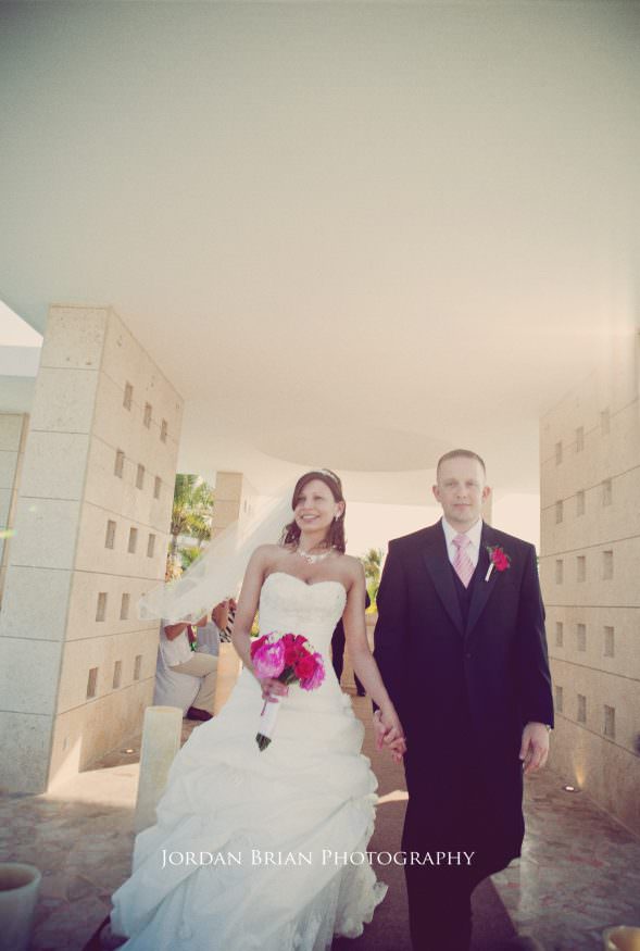 Jill and Ryan portrait at oceanfront ceremony site Playa Mujeres Mexico