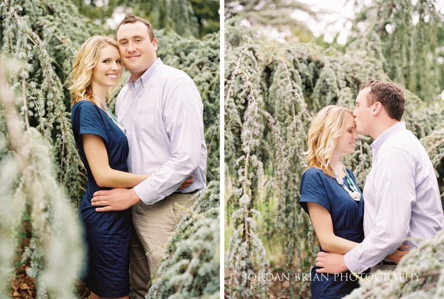 Katarina in blue dress beside bright yellow spring flowers at Fairmount Park engagement session