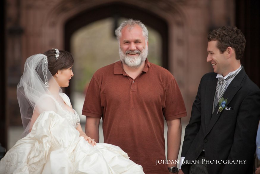 bride and groom photobomb with stranger in front of princeton university before grounds for sculpture wedding