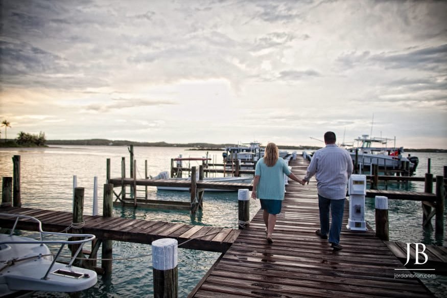 Katie and Luke engagement portrait at boat dock Hope Town Abaco Bahamas