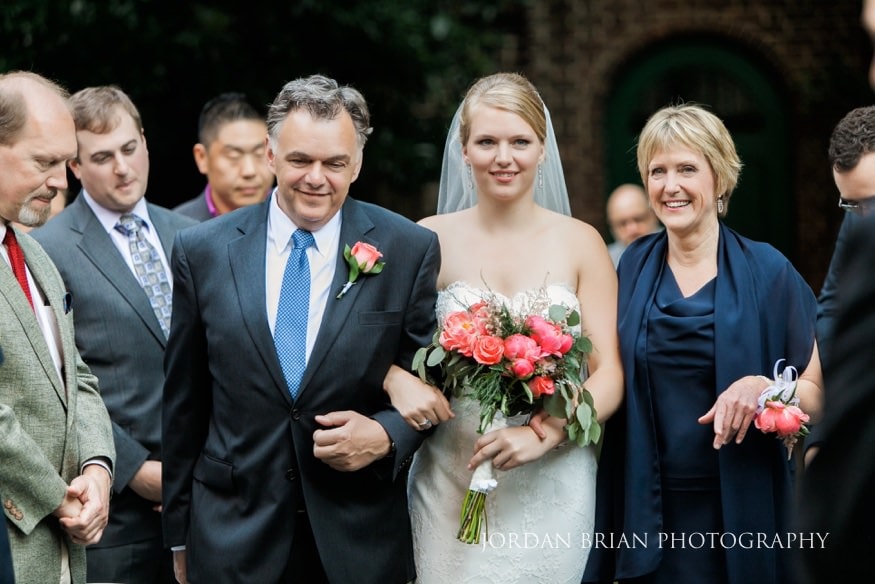 bride walking down isle colonial dames society wedding ceremony