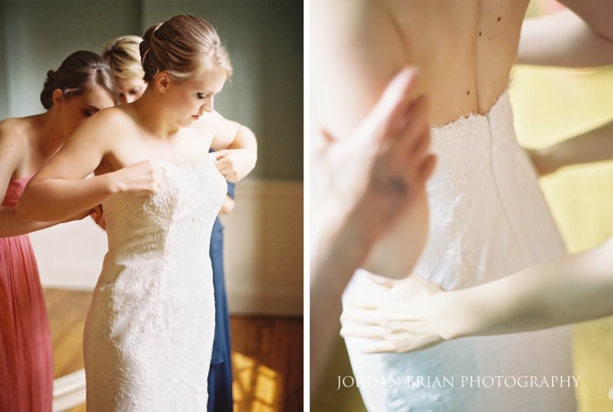 bride putting wedding dress on before ceremony
