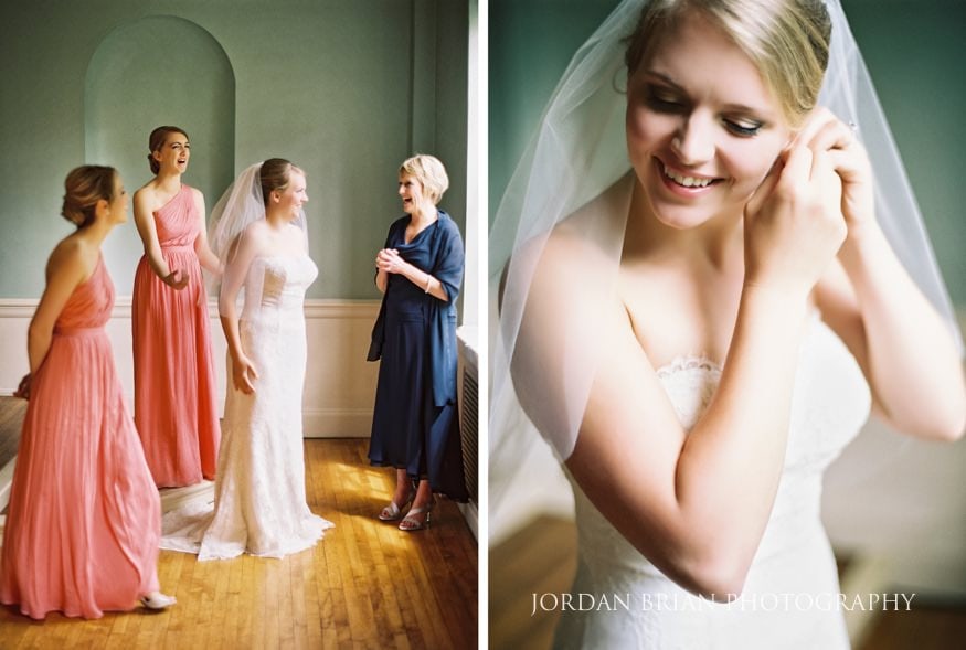 bride putting earrings on