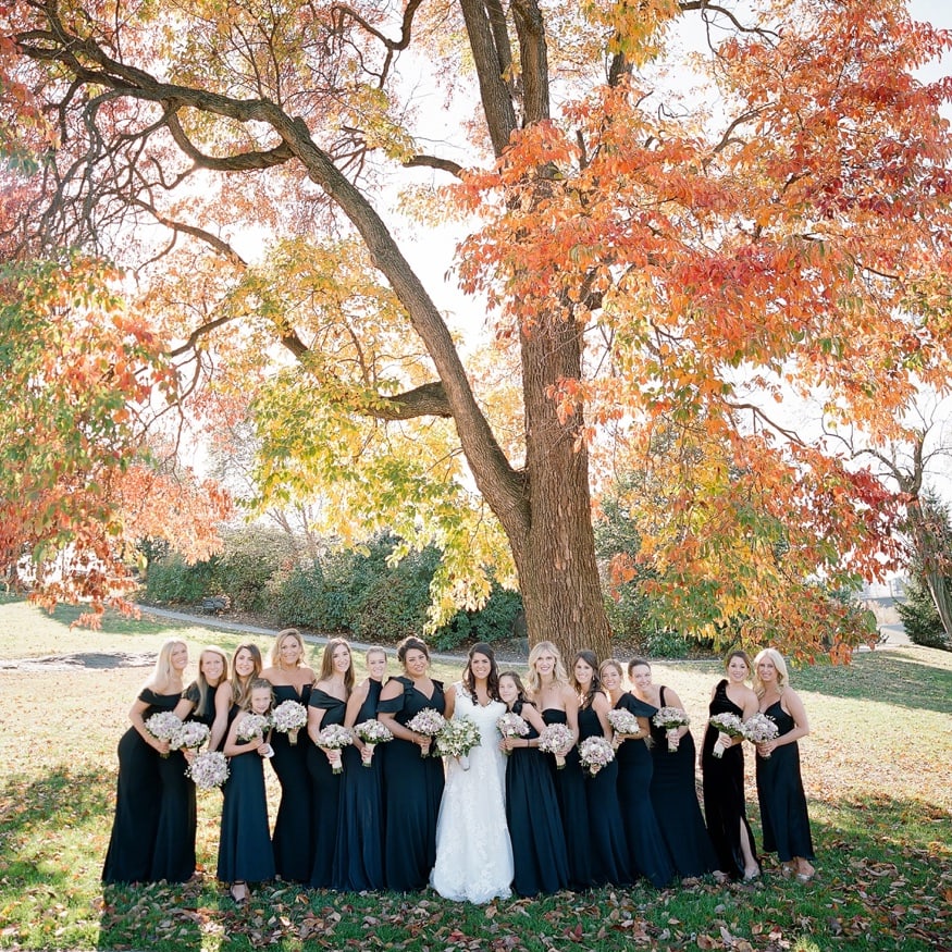 Fall wedding portraits of bridesmaids behind Philly Art Museum.