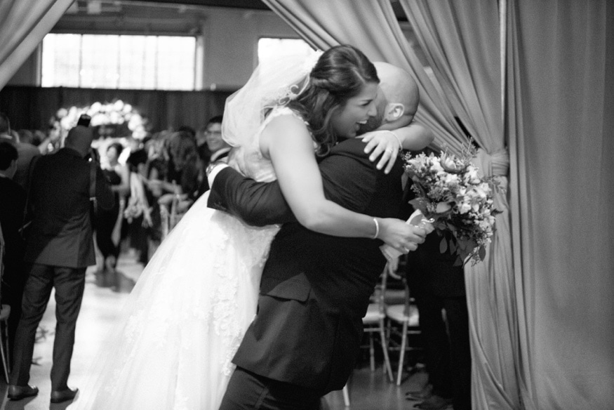 Bride and groom exiting wedding ceremony at Moulin Philadelphia.