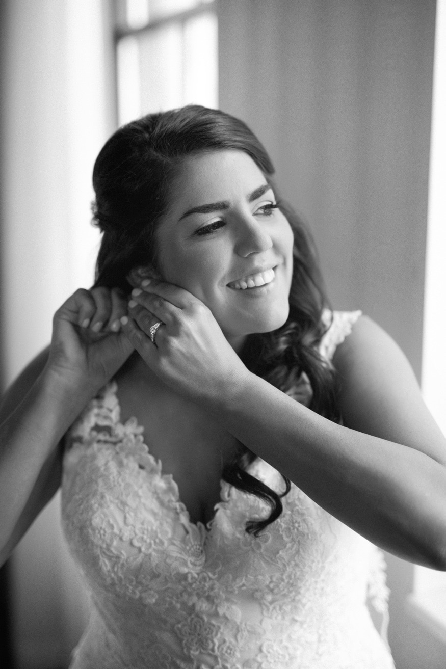 Bride getting ready before wedding at Moulin at Sherman Mills.
