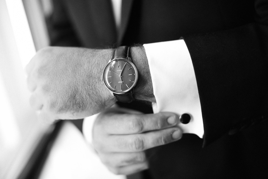 Groom getting ready before wedding at Moulin by Brulee Catering.