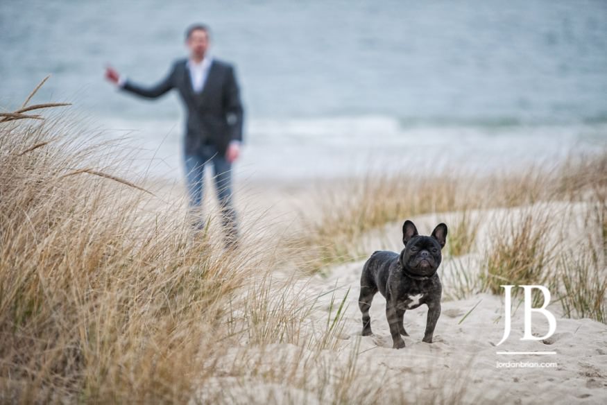 Laura and Justin Virginia Beach engagement session candid moment with dogs