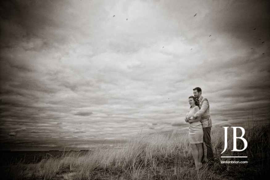 Laura and Justin romantic engagement portrait Virginia Beach ocean backdrop