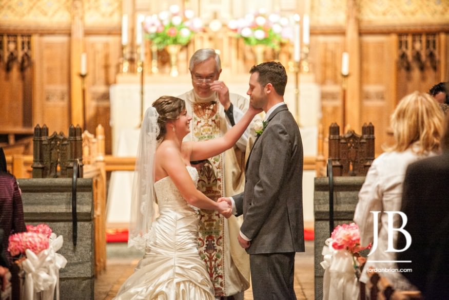 Laura and Justin exchanging vows at Trinity Episcopal Church