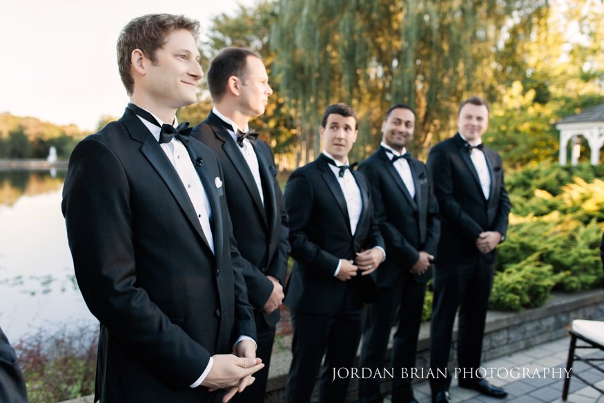 Groom seeing Bride walk down aisle at outdoor wedding ceremony at Windows on the Water.