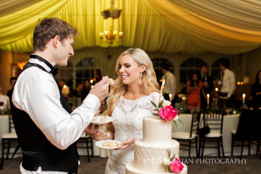 Bride and groom cut wedding cake at Windows on the Water Frogbridge wedding.