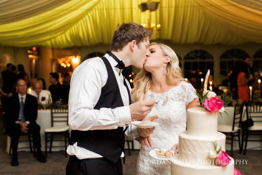 Bride and groom cut wedding cake at Windows on the Water Frogbridge wedding.