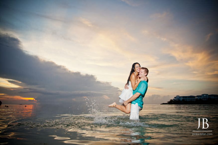 Laurie and Jason smiling together during Jamaica beach engagement session