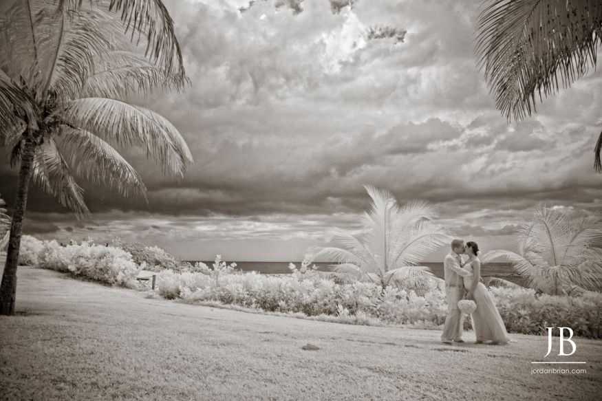Laurie and Jason walking hand in hand on the beach, Jamaica wedding portraits