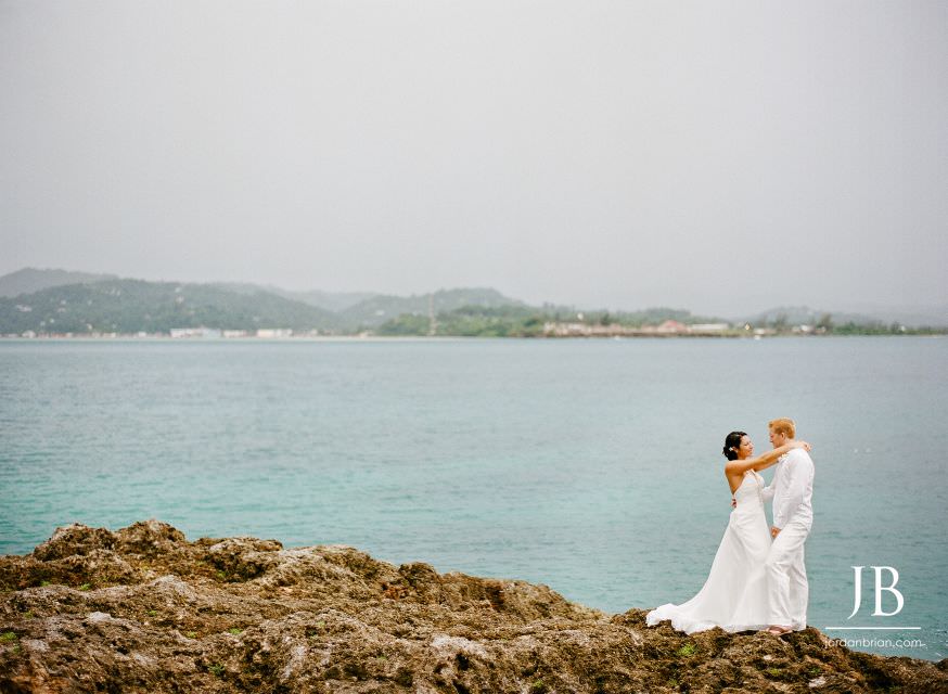 Laurie and Jason portrait with dramatic stormy sky backdrop, Grand Palladium Jamaica