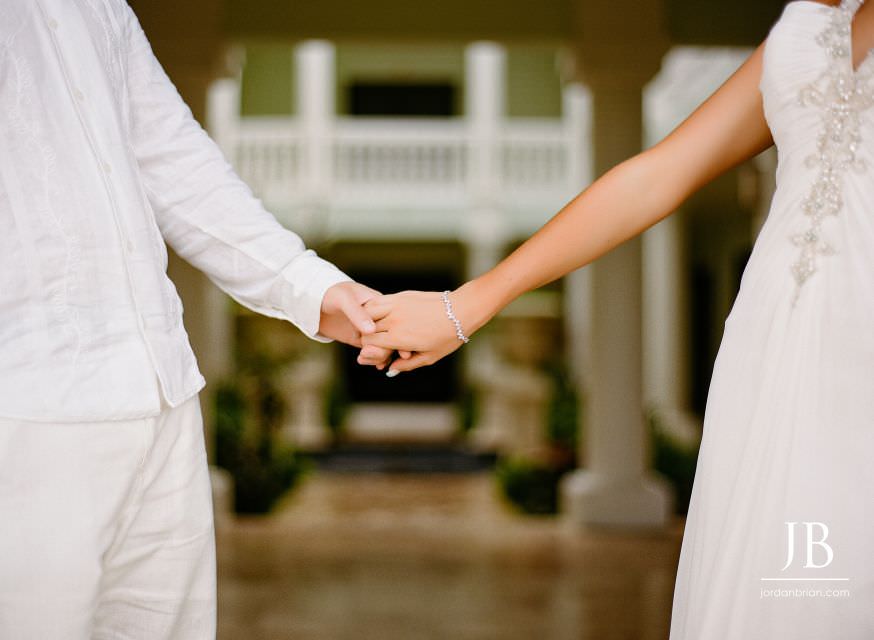 Laurie and Jason walking on the beach after their Jamaica wedding ceremony