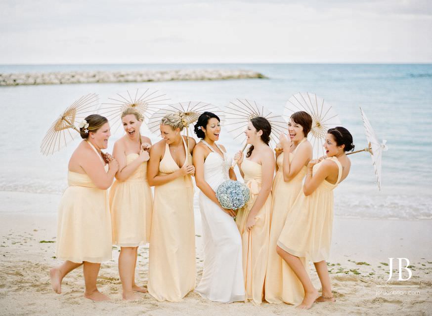 Laurie reaching for Jason during Jamaica beach wedding portraits
