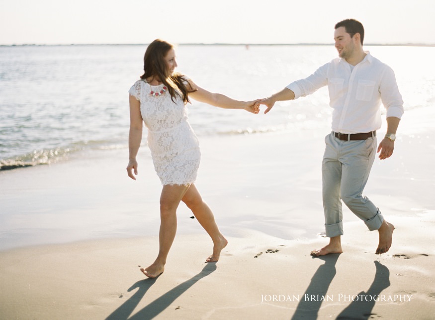 Couple playing on beach Sea Isle City Engagement