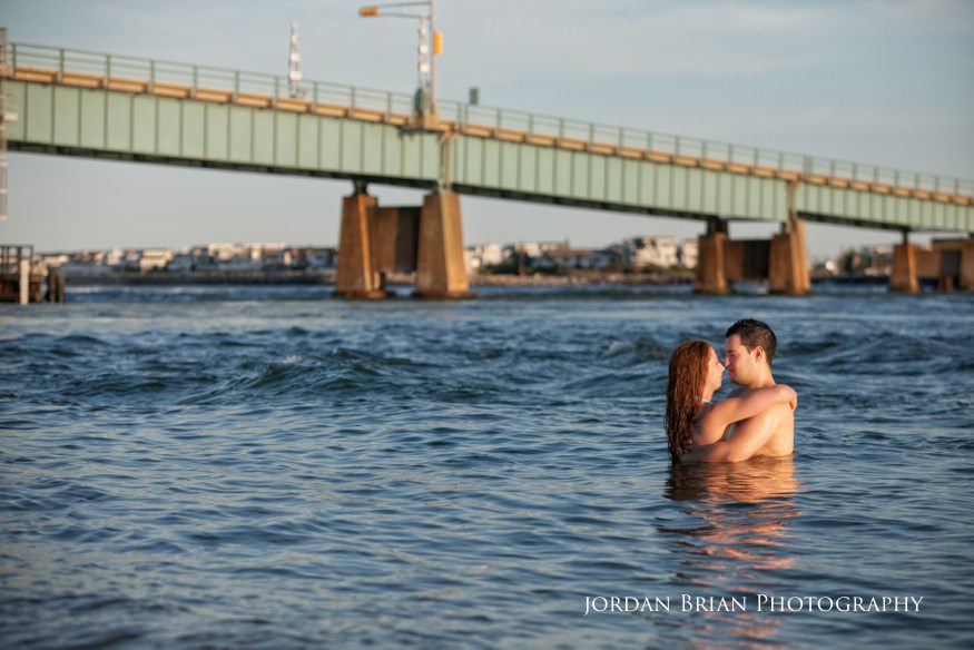 Couple in water sea isle city engagement session