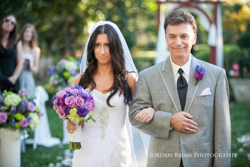 bride walking down aisle with father at wedding ceremony at knowlton mansion