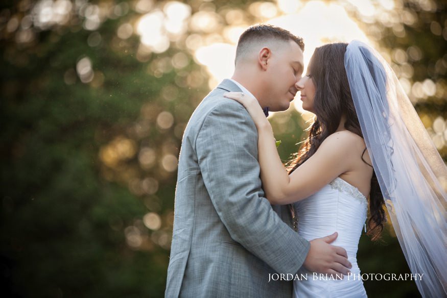 bride and groom kiss at knowlton masion wedding
