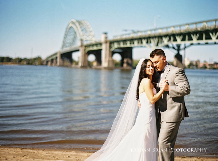 bride and groom portrait infront of tacony palmyra bridge