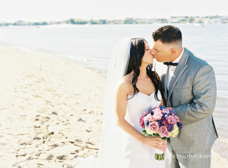 bride and groom portraits by delaware river