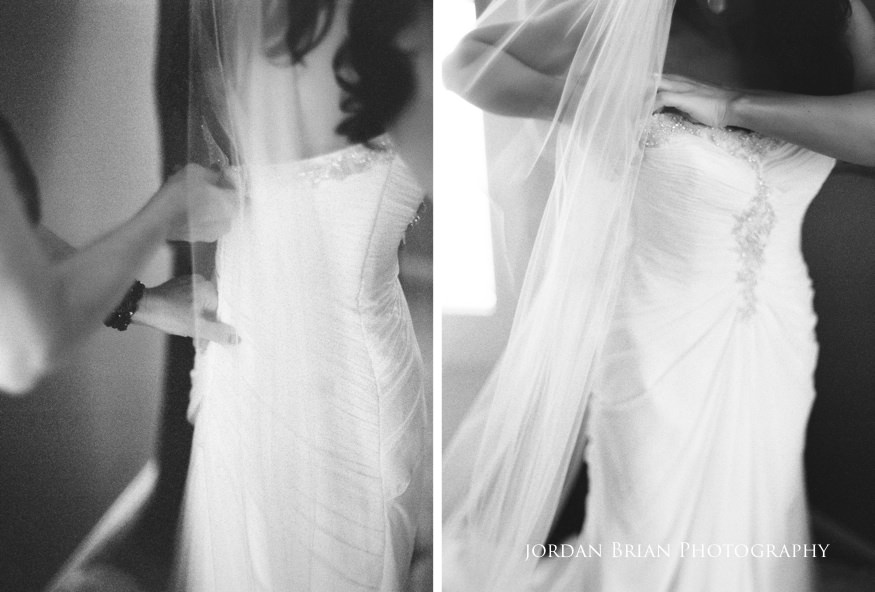 bride putting wedding dress on