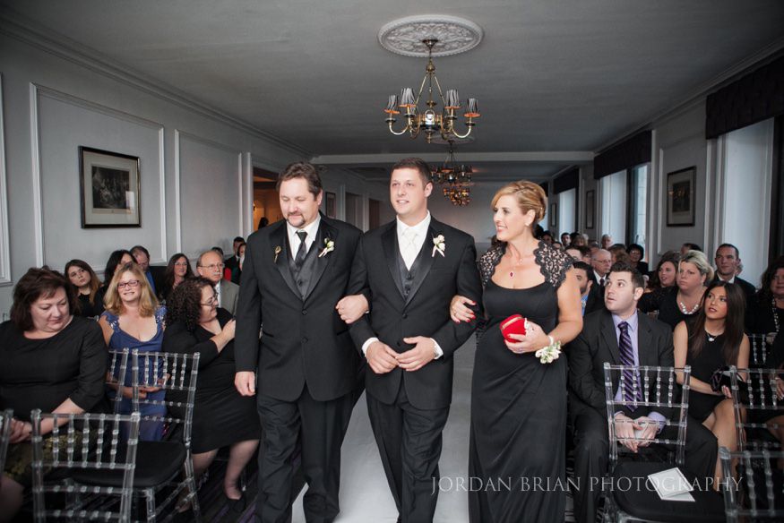 Groom walking down isle Down Town Club Ceremony