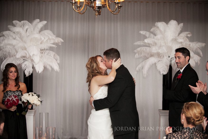 couple kiss Down Town Club Ceremony