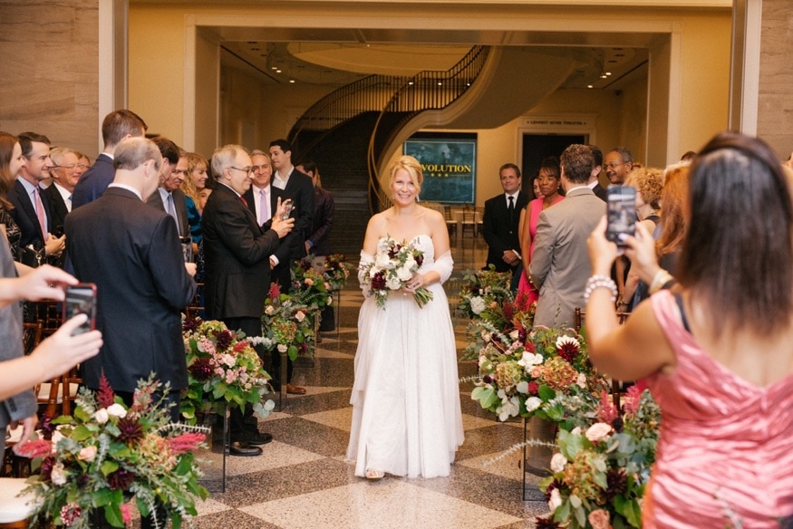 Vertical portrait of Lynn and Greg at the altar, Museum of the American Revolution.