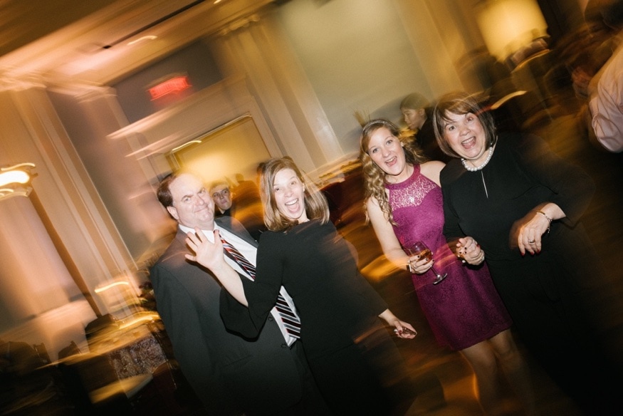 Lynn throwing her bouquet at the Museum of the American Revolution reception.