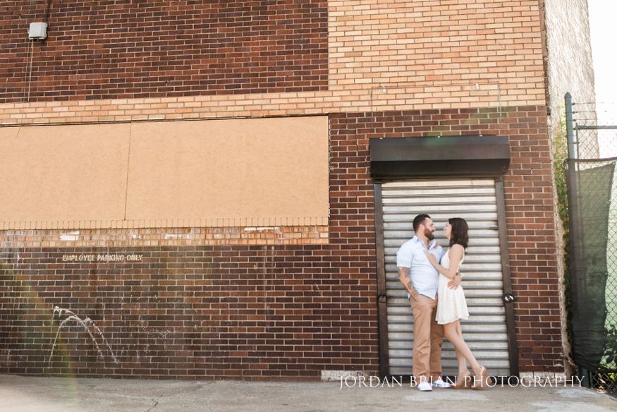 couple infront of adandon building in philadelphia engagement session