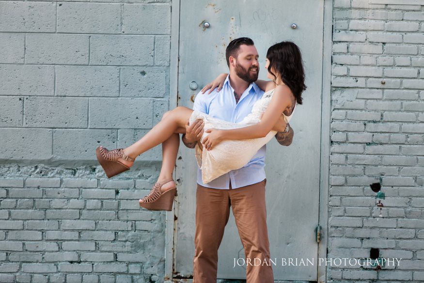 couple infront of blue wall at philadelphia engagement session