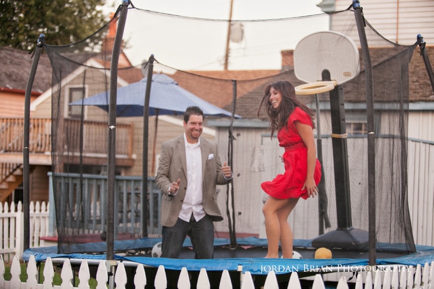 couple on trampoline for chesapeake city engagement session