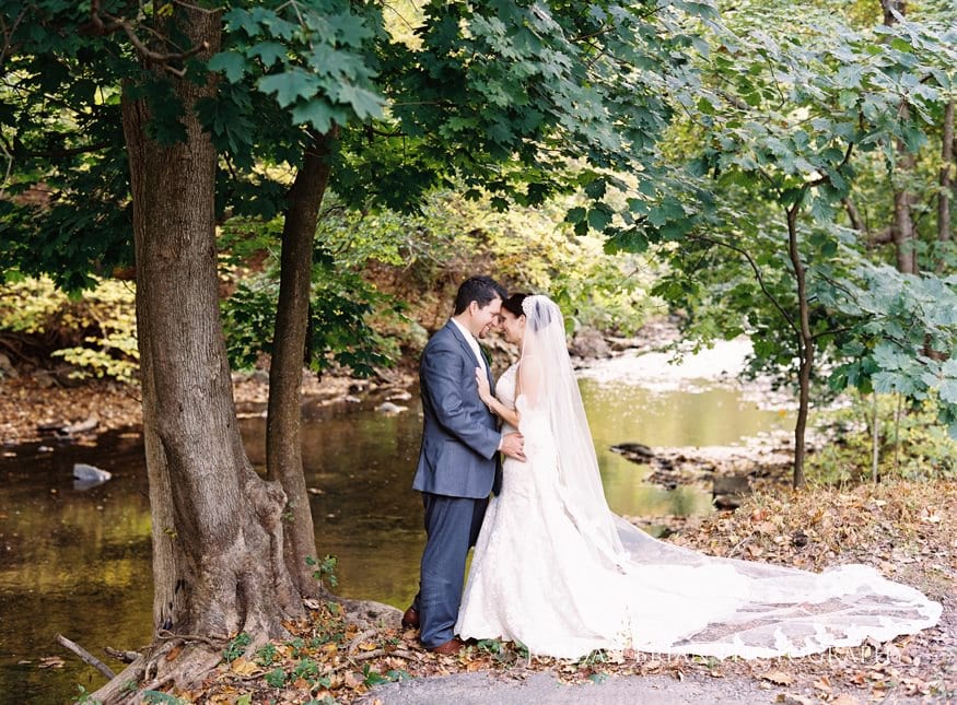 Bride and groom walking bamboo grove Old Mill Rose Valley