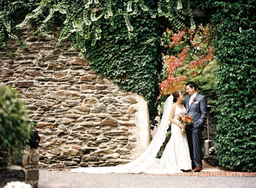 Bride and groom laughing on Old Mill at Rose Valley deck