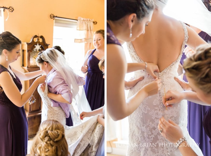 Bride buttoning dress Old Mill Rose Valley fall wedding