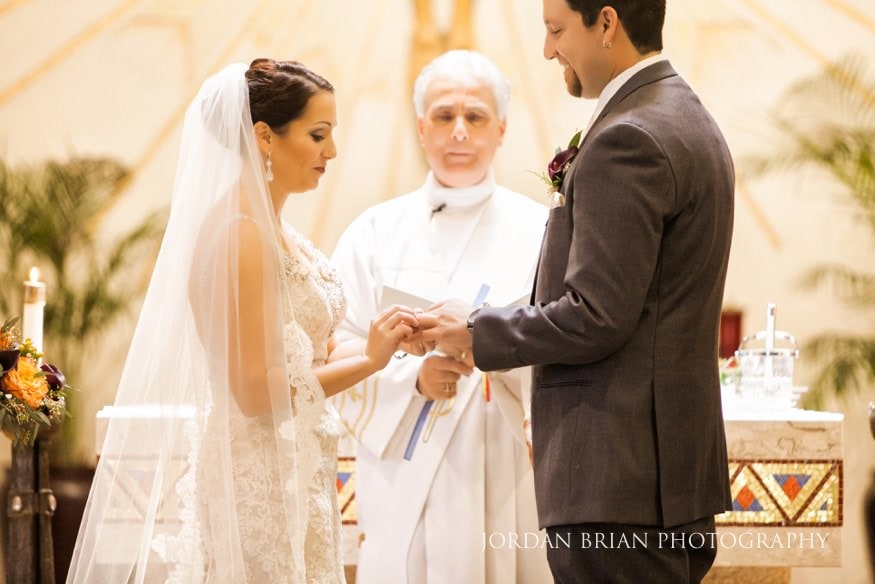 Bride and groom ring exchange St Raphael Catholic Church