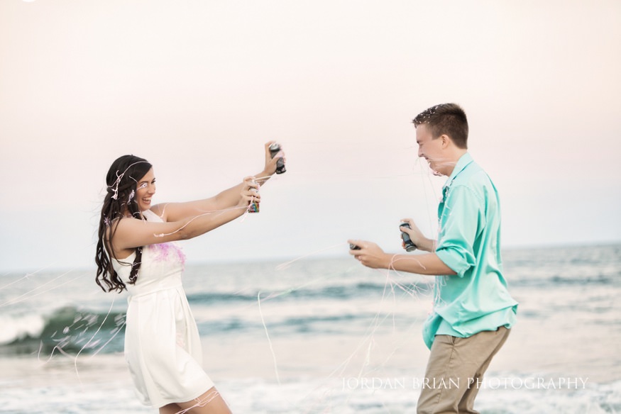 Rebecca and Mat covered in silly string at end of Wildwood engagement session